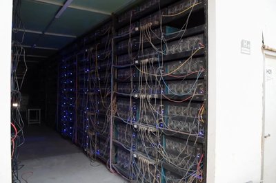 Large-scale Chinese Bitcoin mining farm with rows of mining machines