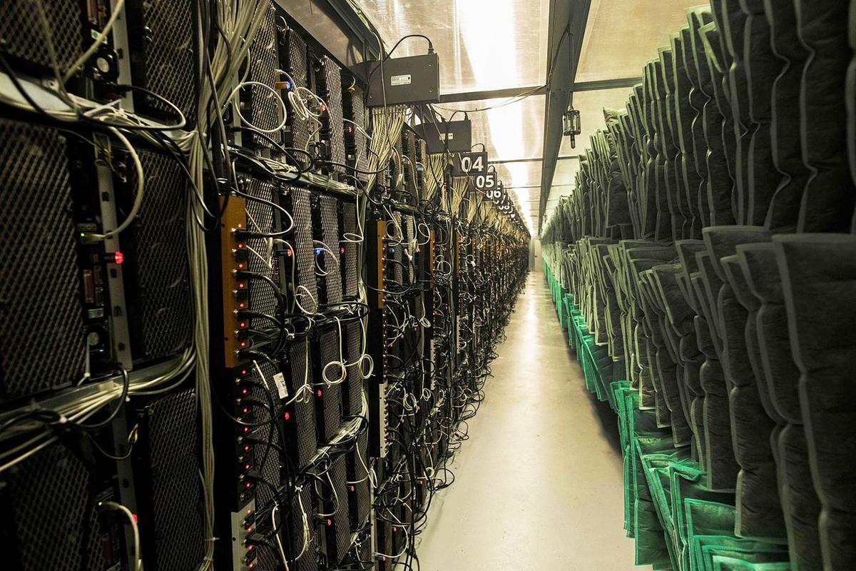An overview of a mining rig setup in a hosted facility, showcasing interconnected machines ready for cryptocurrency extraction